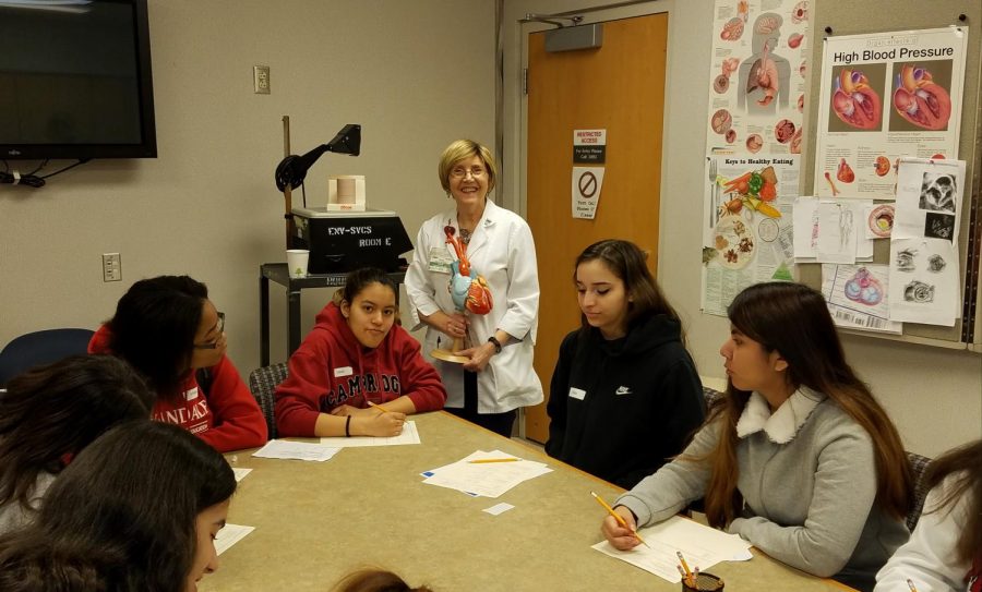 Before the Coronary Artery Bypass Surgery, Nurse Darla Ferris starts the session with a prior knowledge test in the INOVA Dome classroom.