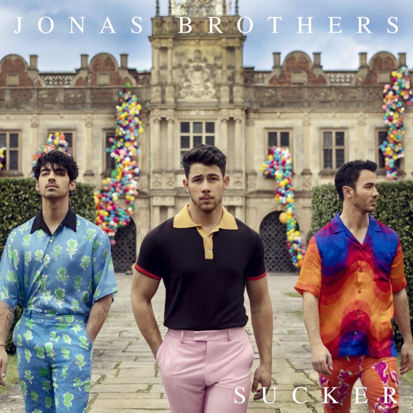 The Jonas Brothers (picutred above) pose in front of their house for their new single “Sucker.”