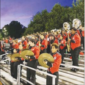 Marching Band students, who would be eligible for this grant, perform at a football game.