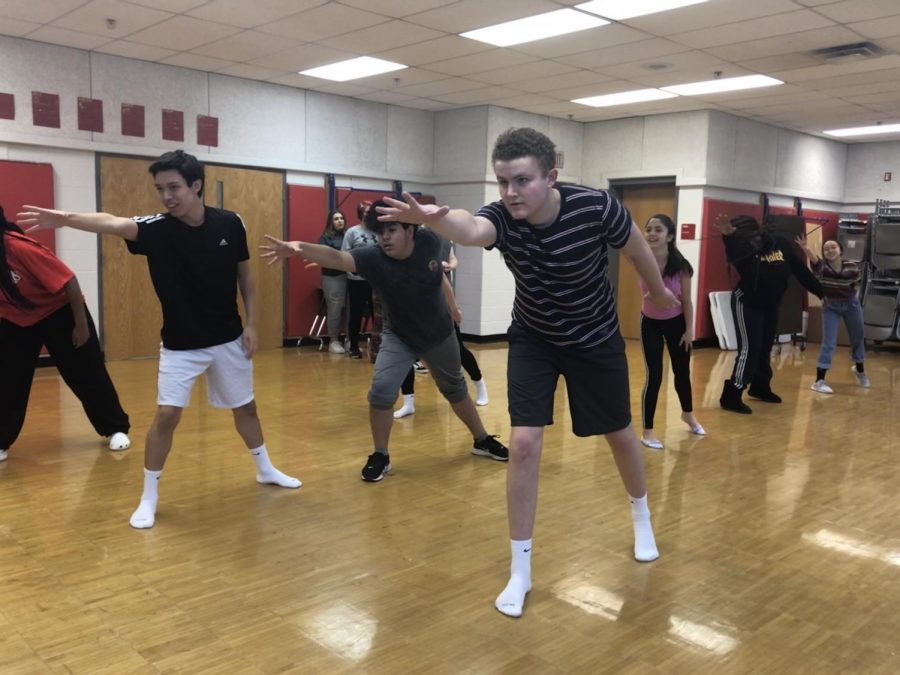 Senior Jack Dalrymple as he leads the Sister Act cast in their dance routine.