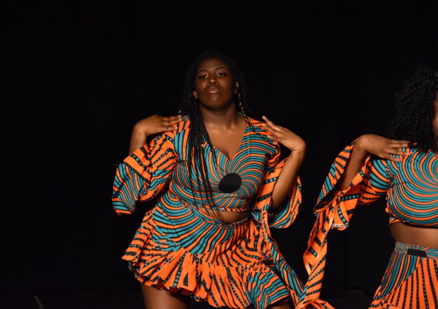 Kadijah Janneh performs a cultural Sierra Leon dance in traditional clothing during Heritage Night in 2019.
