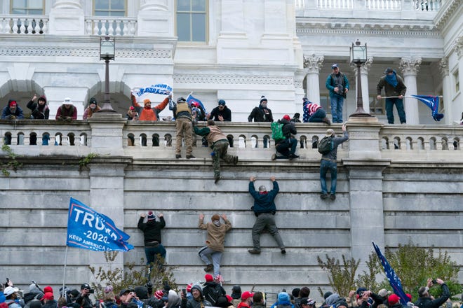 Trump+supporters+scaled+walls+in+their+riot+at+the+U.S.+Capitol+on+Jan.+7.