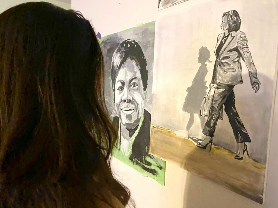 In+honor+of+Black+History+Month%2C+junior+Holly+Waldridge+admires+her+mother%E2%80%99s+paintings+of+important+black+figures+including+Kamala+Harris%2C+Ruby+Bridges+and+Mary+McLeod+Bethune.