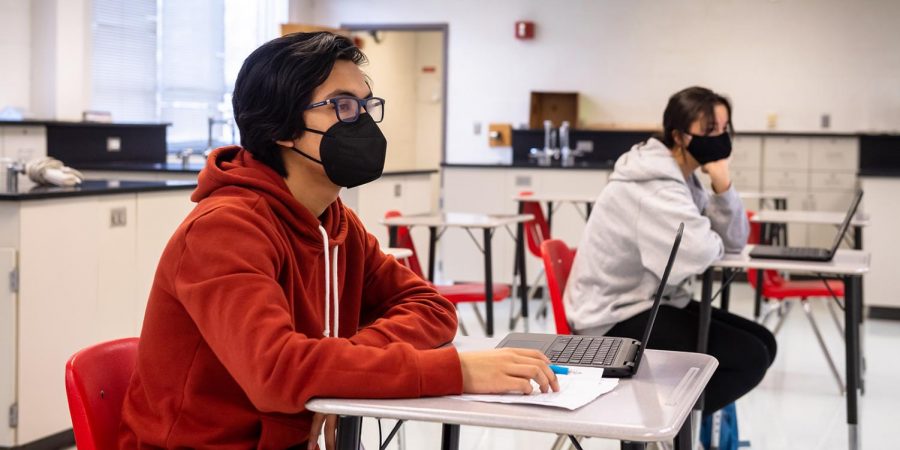 Sophomore Alejandro Orelana attends in-person instruction as part of the hybrid learning model with two days of in-person instruction and two days of online instruction. The model has had success in bringing students back into the building safely.