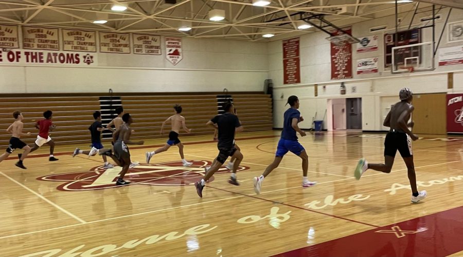 Varsity+basketball+players+run+sprints+in+the+gym+to+prepare+for+the+upcoming+season.