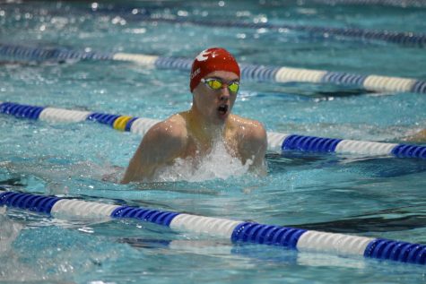 Sophomore Colin Mcgee swims the 100 yd breaststroke against Edison in their meet on Jan. 21. Colin placed first in the event.