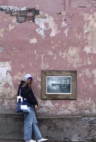 Gizela Gunin stands next to a painting in Estonia