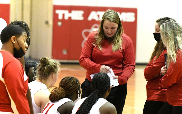 The girls basketball team receives offensive play design in game against Mt. Vernon on senior night. The Atoms won by a score of 33-27.