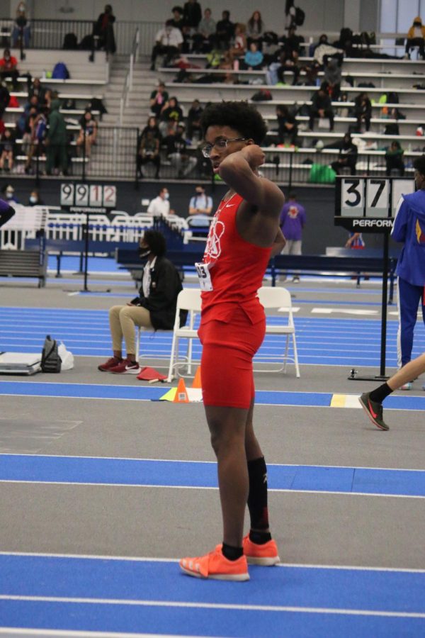 Junior Miles Lanham stands on the track as he is about to line up for a regional event.