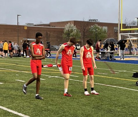 Atoms long distance boys prepare for the mile race at the John R. Lewis meet on March 23.