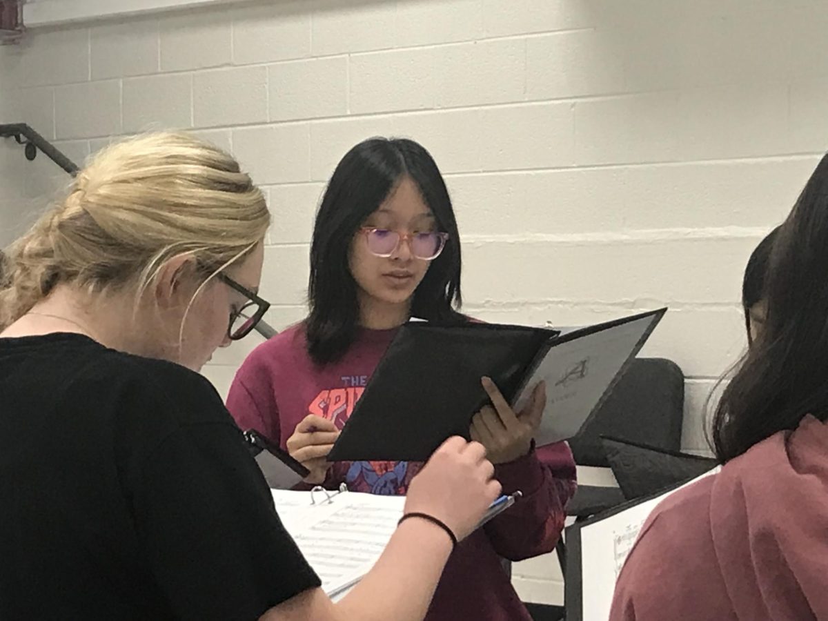 Kaylyn Truong practices for the upcoming District Chorus auditions with her classmates.