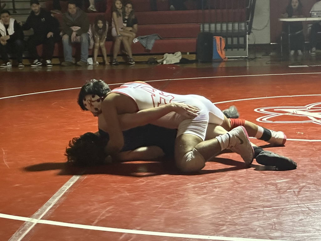 Junior Sebastian Jaldin sets up for a pin against West Potomac High School, 01/26