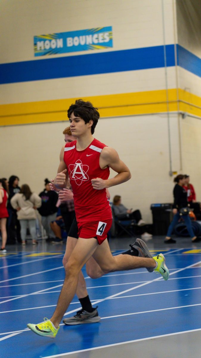 Sophomore Nathaniel Dosen competes in his event at a regular season track meet