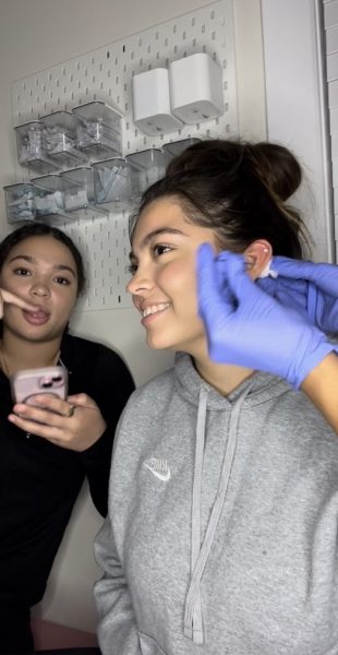 Sophomore Angie Marquez getting her ear pierced.