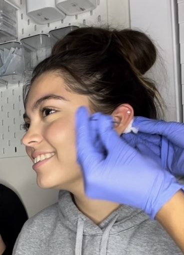 Sophomore Angie Marquez getting her ear pierced.