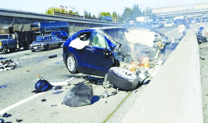 Northbound view of the crash scene before the Tesla was engulfed in flames.