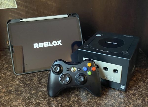 These are the signature gaming devices of each generation: the iPad, Xbox, and GameCube