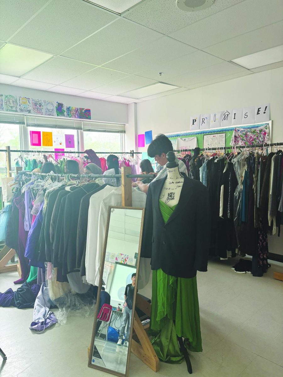 Students look through the racks at the  Prom-ise pop-up shop in room 210.