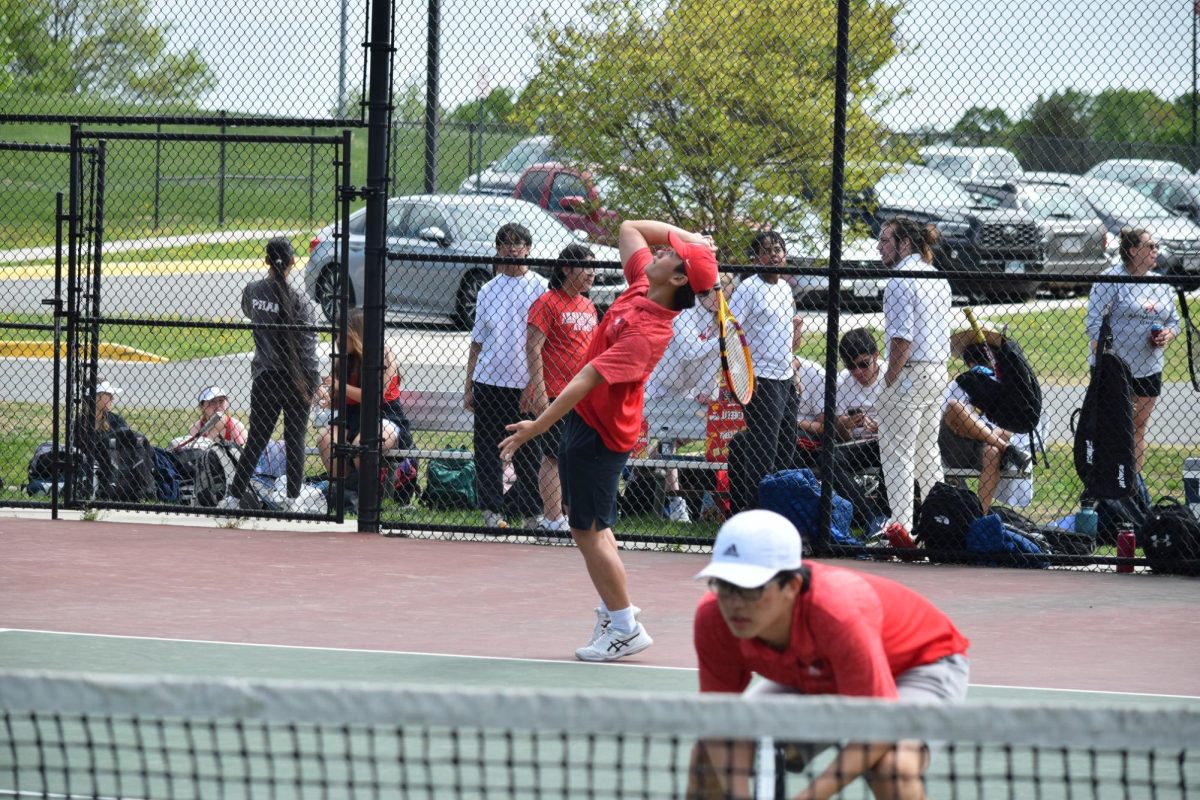 Seniors Quang Bui and Keane Ong set up to serve a point in practice, 04/26